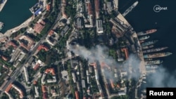 A satellite image shows smoke billowing from a Russian Black Sea Navy headquarters after a missile strike, as Russia's invasion of Ukraine continues, in Sevastopol, Crimea, Sept. 22, 2023. (Planet Labs PBC/Handout via Reuters)