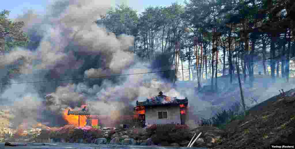 A view shows buildings being burnt down by wildfire in Gangneung, South Korea.
