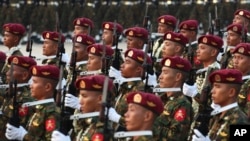 (FILE) Burmese military officers march during a parade.