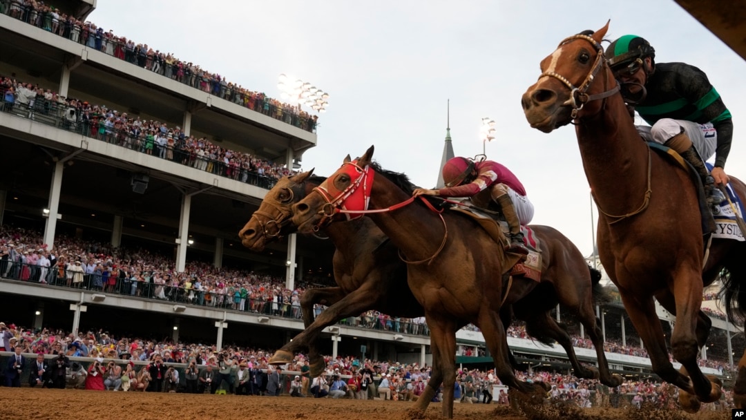 Brian Hernandez Jr. and Mystik Dan, right, get to the finish line first to win the 150th running of the Kentucky Derby horse race at Churchill Downs in Louisville, Kentucky, May 4, 2024.