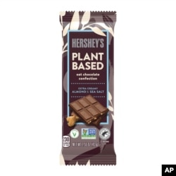 This image provided by The Hershey Company shows the company's new Hershey’s plant-based extra creamy with almonds and sea salt. The candy will go on sale in April.