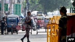 Border Security Force (BSF) personnel stand guard at the India-Bangladesh border of Petrapole about 100km north east of Kolkata, Aug. 6, 2024.