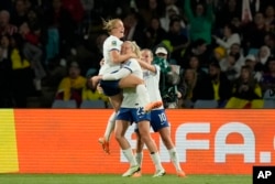England's Alessia Russo, center, celebrates after scoring her side's 2nd goal during the Women's World Cup quarterfinal soccer match between England and Colombia at Stadium Australia in Sydney, Australia, Aug. 12, 2023.