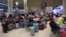 Passengers wait at Ben Gurion Airport near Tel Aviv, Israel, Oct. 7, 2023, as flights are canceled because of the Hamas surprise attack.