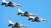 FILE - U.S.-made F-16 fighter jets fly over Warsaw, Poland, to celebrate the Polish Army Day, Aug. 15, 2023. Ukraine has received the first tranche of western F-16 fighter jets that it sought to help it fight Russian missile strikes, a U.S. official confirmed to the AP.
