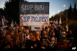 People protest against Israeli Prime Minister Benjamin Netanyahu's government and call for the release of hostages held in the Gaza Strip by the Hamas militant group, in Jerusalem, June 27, 2024.