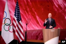 Utah Gov. Spencer Cox speaks about Salt Lake City's bid to host the 2034 Winter Olympics, during the 142nd IOC session at the 2024 Summer Olympics, July 24, 2024, in Paris, France.