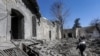 Sejumlah bangunan mengalami kerusakan setelah serangan Israel di Damaskus, Suriah pada 19 februaru 2023. (Foto: Louai Beshara/AFP)