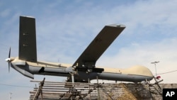 FILE - In this Feb. 11, 2016 file photo, Iranian drone Shahed-129 is displayed at a rally in Tehran, Iran. 