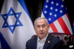 FILE - Israeli Prime Minister Benjamin Netanyahu speaks during a meeting with U.S. President Joe Biden in Tel Aviv, Israel, on Oct. 18, 2023.