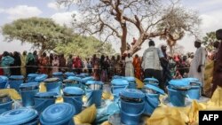 Personnel form the United Nations Children's Fund (UNICEF) and from the NGO Premiere Urgence prepare aid kits for Sudanese refugees who crossed into Chad, in Koufroun, near Echbara, on April 30, 2023.