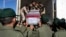 Iranian soldiers move a flag-draped coffin of a victim of a Jan. 3 bomb explosion in Kerman, about 820 kms southeast of Tehran, Iran, Jan. 5, 2024. Iran's state TV reported on Jan. 21 that a soldier killed five comrades in Kerman.