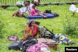 Residents camp at an open field after their homes were swamped following rains that triggered flooding and landslides in Rubavu district, Western province, Rwanda, May 3, 2023.