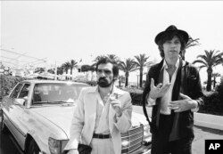 FILE - Director Martin Scorsese, left, and Robbie Robertson attend the 31st Cannes International Film Festival, in France, where they presented "The Last Waltz" on May 29, 1978.