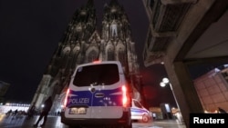 FILE - German police secure the cathedral in central Cologne, Germany, Dec. 23, 2023.