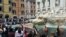 A photo taken and issued as a handout on May 21, 2023 by environmental activists shows banners reading 'we don't pay for the fossil' in historic Fontana di Trevi fountain, in Rome. (Photo by handout / Last Generation / AFP) 