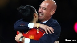 FILE - Spain's Jennifer Hermoso celebrates with President of the Royal Spanish Football Federation Luis Rubiales after the match, August 20, 2023. (REUTERS/Hannah Mckay)