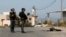 Members of the Israeli forces stand guard during clashes with Palestinians, near Tulkarm, in the Israeli-occupied West Bank, Oct. 5, 2023.