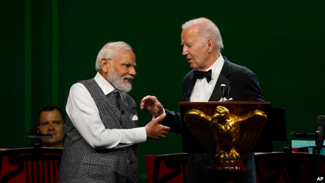 President Joe Biden talks with India's Prime Minister Narendra Modi at a state dinner at the White House in Washington, June 22, 2023.