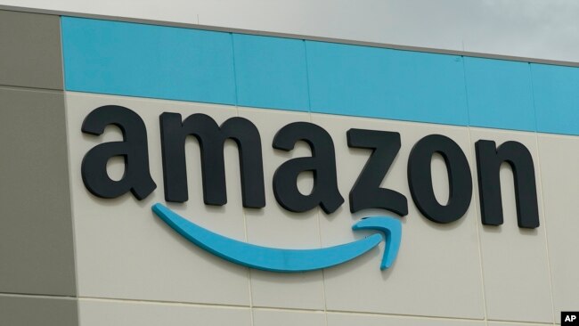 FILE - The familiar sign at the Amazon Robotic Sorting Fulfillment Center in Madison County, Miss., Thursday, Aug. 11, 2022. AP Photo/Rogelio V. Solis)