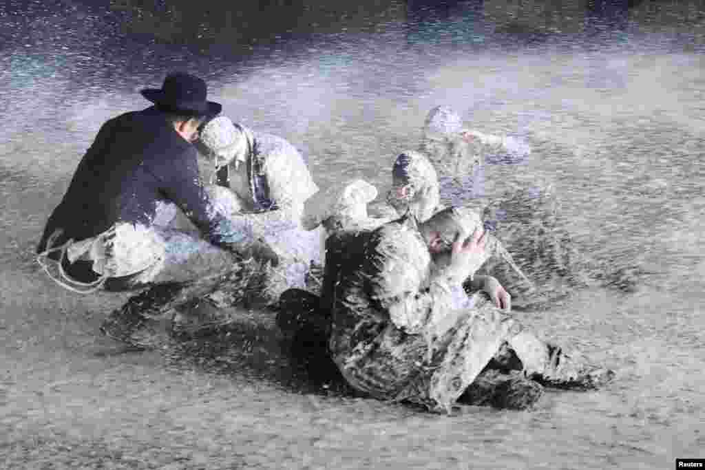 Security forces use water canon to disperse Ultra-Orthodox Jewish men protesting against army recruitment in the Mea Shearim neighborhood of Jerusalem, June 30, 2024. The Supreme Court&#39;s ruling required the state to begin drafting ultra-Orthodox Jewish seminary students to the military.