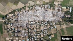 (FILE) An aerial view of a village in Sagaing region after villagers say it was set ablaze by the Myanmar military.