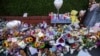 Flowers and toys are placed on the junction of Tithebarn Road and Hart Street in Southport, England, July 31, 2024, after three girls were killed in a knife attack at a Taylor Swift-themed holiday club earlier in the week. 