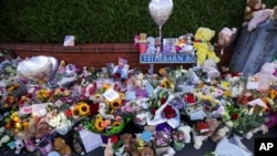 Flowers and toys are placed on the junction of Tithebarn Road and Hart Street in Southport, England, July 31, 2024, after three girls were killed in a knife attack at a Taylor Swift-themed holiday club earlier in the week. 