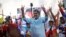 FILE - Venezuelan President Nicolas Maduro flashes victory hand signs at supporters during a pro-government rally, in Caracas, Venezuela, Aug. 17, 2024. 