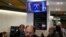Customers have breakfast in a restaurant while Spanish Prime Minister Pedro Sanchez appears on a television broadcast in Madrid, April 29, 2024. 