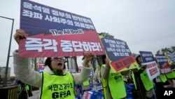 Members of the Gyeonggi Province Medical Association stage a rally against the government's medical policy near the presidential office in Seoul, South Korea, April 3, 2024. The banners read "Stop President Yoon Suk Yeol government's medical policy."