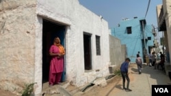 Sushila Kumari got government support to build a concrete room and a toilet. (Anjana Pasricha/VOA)