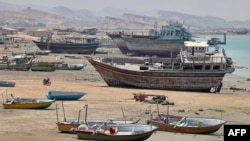 Traditional wooden ships, called lenjes, are pictured on Iran's touristic Qeshm island in the Gulf, on April 29, 2023.