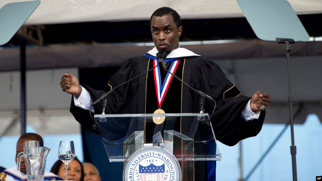 FILE - Entertainer and entrepreneur Sean "Diddy" Combs delivers Howard University's commencement speech during the school's 2014 graduation ceremony in Washington, May 10, 2014. Howard University has announced it is cutting its ties to Combs.
