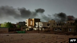 FILE - Smoke billows in southern Khartoum on May 29, 2023, amid ongoing fighting between two rival generals in Sudan.