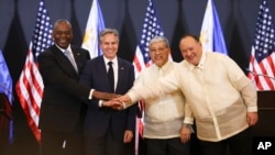 U.S. Defense Secretary Lloyd Austin, Secretary of State Antony Blinken, Philippine Foreign Secretary Enrique Manalo and National Defense Secretary Gilberto Teodoro at a joint news conference in Manila, Philippines, July 30, 2024.