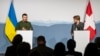 Swiss President Viola Amherd, right, listens to Ukraine President Volodymyr Zelenskyy, left, as they address the media after their bilateral talks in Kehrsatz near Bern, Switzerland, on Jan. 15, 2024. 