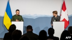 Swiss President Viola Amherd, right, listens to Ukraine President Volodymyr Zelenskyy, left, as they address the media after their bilateral talks in Kehrsatz near Bern, Switzerland, on Jan. 15, 2024. 