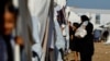 Palestinians, who fled their houses amid Israeli strikes, take shelter at a tent camp at a United Nations-run center, in Khan Younis in the southern Gaza Strip, Oct. 26, 2023. 