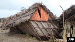 FILE - This traditional house of the east coast of Madagascar was destroyed by Cyclone Freddy in Mananjary on Feb. 23, 2023. The storm later hit Mozambique, and on March 10 it was on track to hit the coast of southern Africa again.