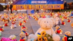 Members of the organization Avaaz and Ukrainian refugees installed teddy bears and toys in front of the European Commission to highlight the reported abduction of Ukrainian children by Russia. February 23, 2023, Brussels. (Avaaz via AP)