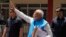 Indian Prime Minister Narendra Modi waves to the public as he returns after filing his nomination papers to contest as a candidate for the parliamentary elections in Varanasi, Uttar Pradesh state, India, May 14, 2024. 