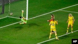 Sweden's goalkeeper Zecira Musovic, left, fails to save a goal scored by Spain's Salma Paralluelo during the Women's World Cup semifinal soccer match between Sweden and Spain at Eden Park in Auckland, New Zealand, Aug. 15, 2023. 