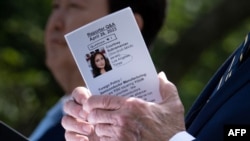 U.S. President Joe Biden holds notes while answering a question during a press conference in the Rose Garden of the White House after meeting with South Korea's President Yoon Suk Yeol in Washington, April 26, 2023.