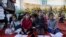 FILE - Children attend a makeshift class in Deir al Balah, Gaza Strip, April 21, 2024.