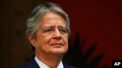 FILE - Ecuador's President Guillermo Lasso attends his welcoming ceremony at the National Palace in Mexico City, Nov. 24, 2022. 