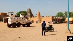 FILE - United Nations forces patrol the streets of Timbuktu, Mali, on Sept. 26, 2021. 