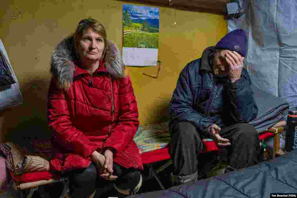 Larissa Polyakova and her father, Ivan Zaika, have lived in a basement for three months since the Russian attacks against Kupiansk intensified, Feb. 17, 2023.