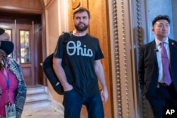 FILE - Sen. J.D. Vance, R-Ohio, arrives as the Senate prepares a procedural vote on an emergency spending package that would provide military aid to Ukraine and Israel, plus other items, at the Capitol in Washington, Feb. 11, 2024.