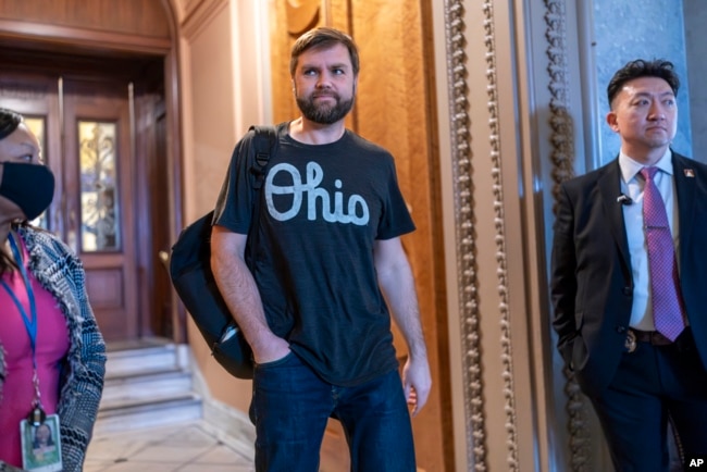 FILE - Sen. J.D. Vance, R-Ohio, arrives as the Senate prepares a procedural vote on an emergency spending package that would provide military aid to Ukraine and Israel, plus other items, at the Capitol in Washington, Feb. 11, 2024.